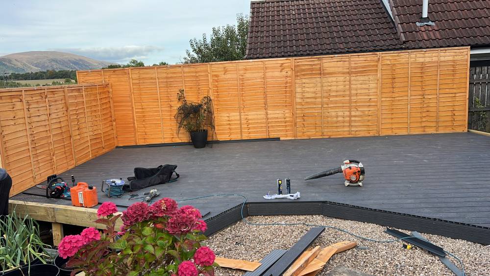 Composite decking with lap panel fencing and Ochil Hills backdrop