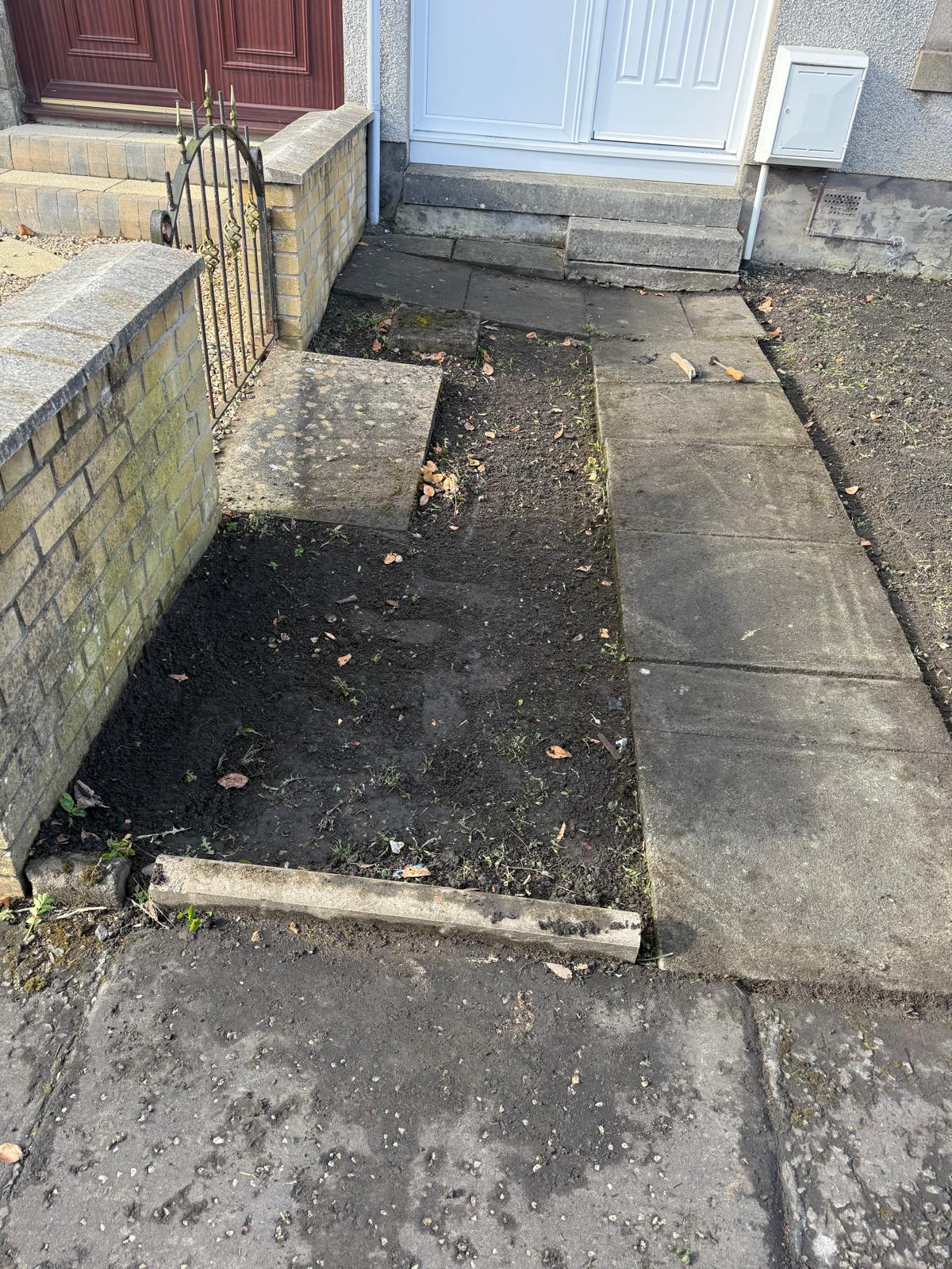 Front garden before transformation showing worn path and entrance