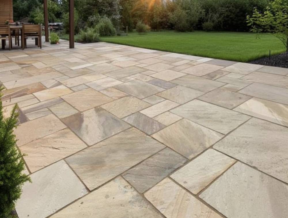 Indian sandstone patio with garden lawn