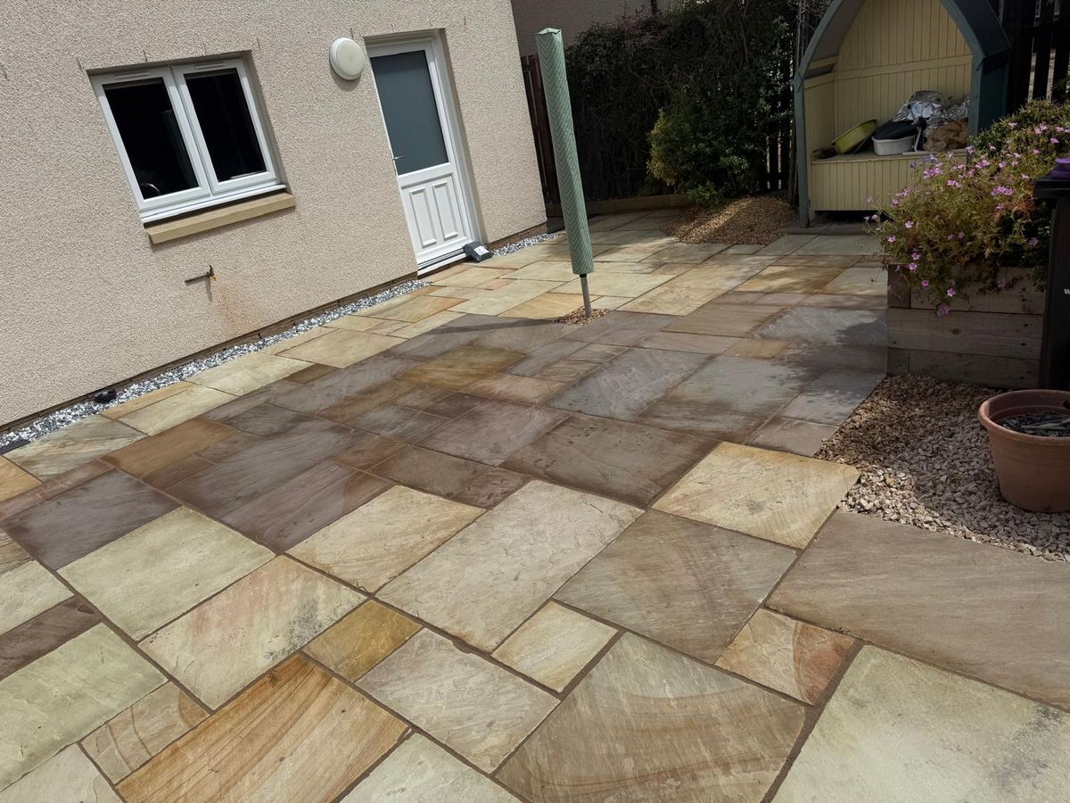 Newly laid Indian sandstone patio in a rear garden