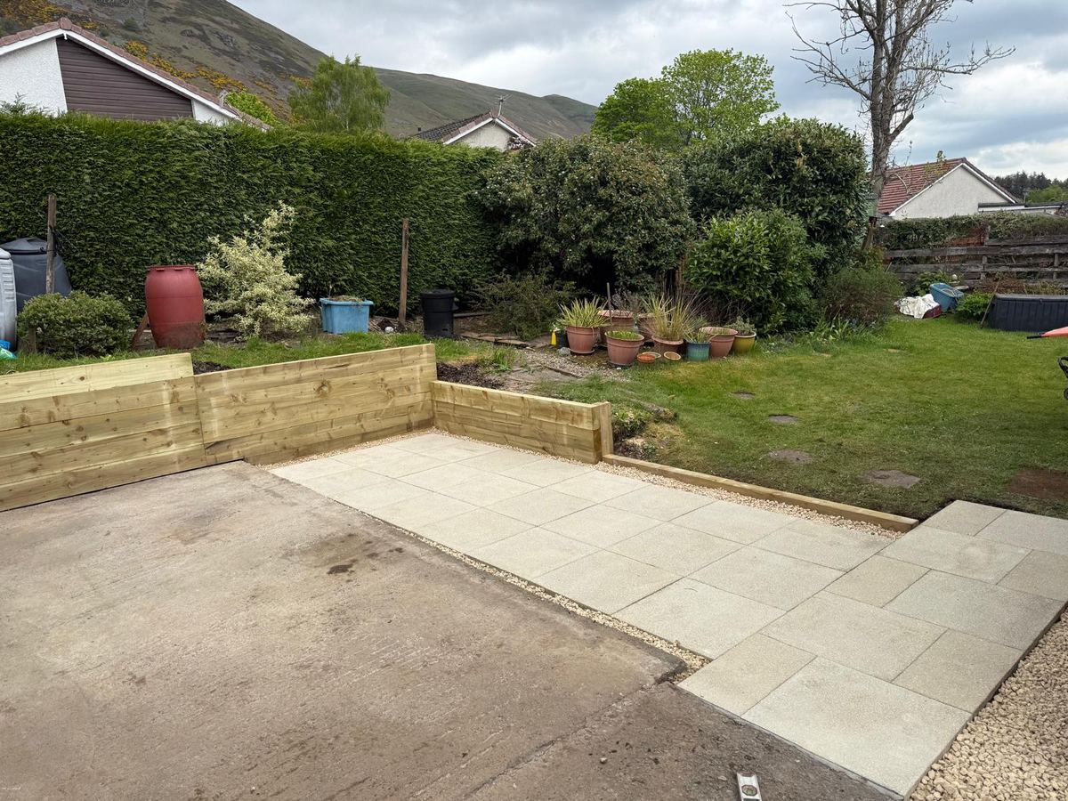 Porcelain patio with timber sleeper retaining walls