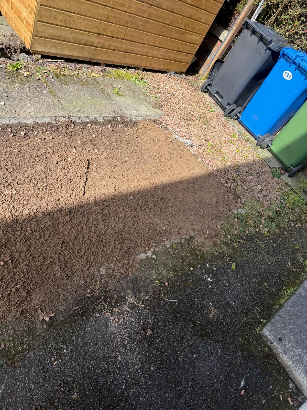 Side path soil preparation and clearance in progress