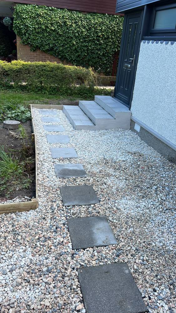 Stepping stone path through gravel garden area
