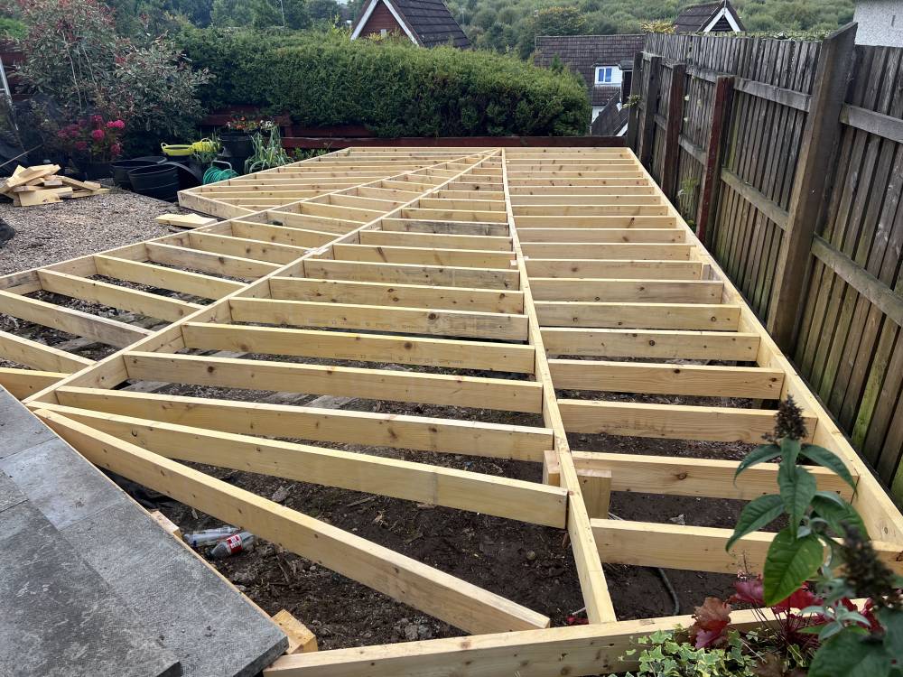 Timber deck frame construction in garden by Forth Tree Garden Landscaping