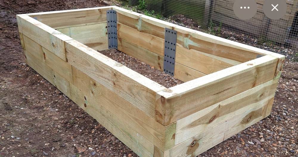 Timber raised bed planter with bark mulch filling