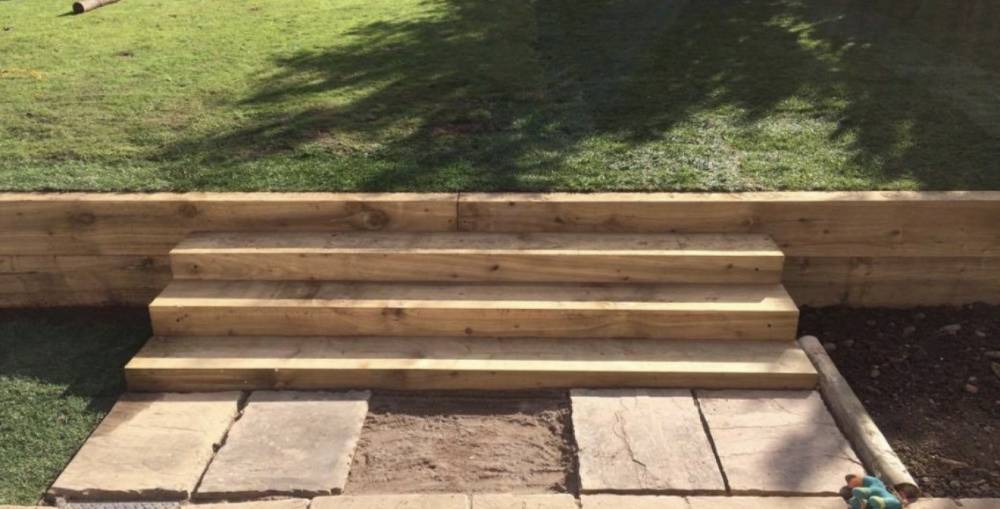 Timber sleeper garden steps between lawn levels